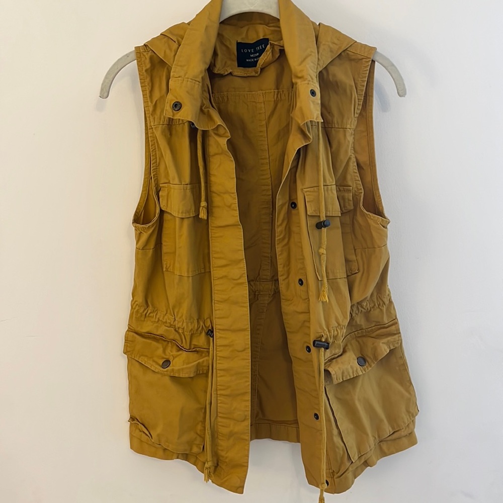 Medium- Mustard yellow vest with hood, cinchable waist.